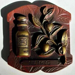 1976 Miller Studio  chalkware Nutmeg wall hanging with faux metallic paint
